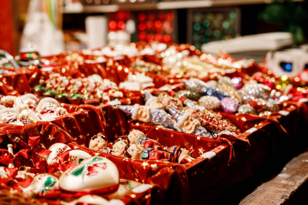 Colorful close up details of christmas fair market. Balls decorations for sales. Xmas market in Germany with traditional decorative toys