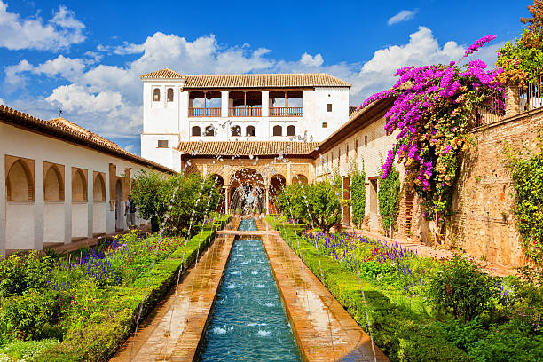 Granada, Spain - October 3, 2013: General view of the Generalife with its famous fountain and garden. Alhambra de Granada. UNESCO World Heritage Site